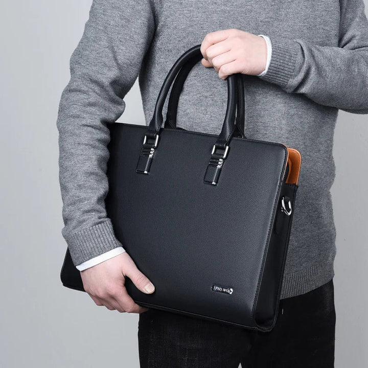 Portaro luxe heren laptoptas in zwart, gedragen als stijlvolle werktas voor 14/15 inch zakelijke laptops.