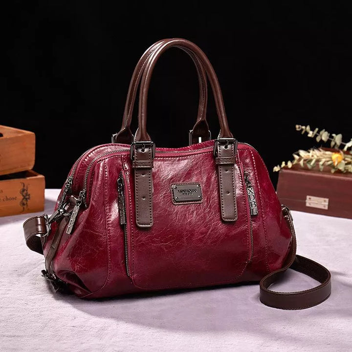 Luxe dames leren handtas met elegante textuur, praktisch en ruim verkrijgbaar in bruin, groen, rood of zwart voor een veelzijdige stijl