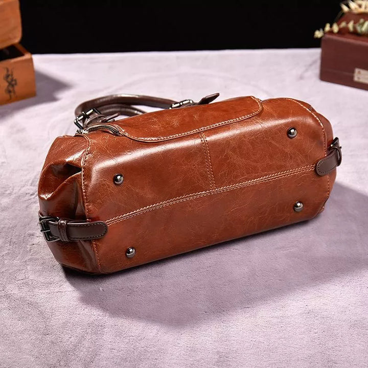 Luxe dames leren handtas met elegante textuur, praktisch en ruim verkrijgbaar in bruin, groen, rood of zwart voor een veelzijdige stijl