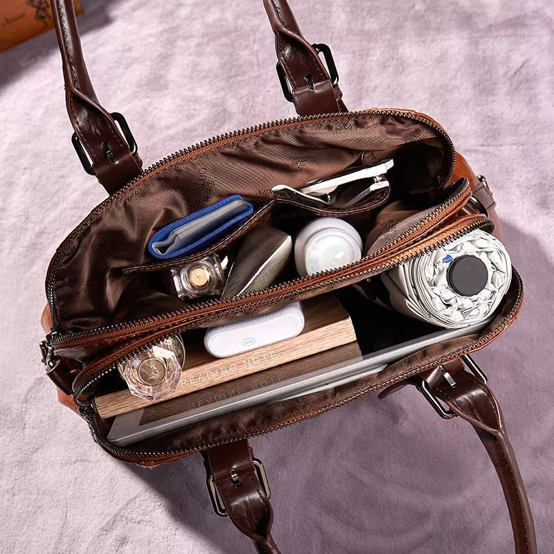 Luxe dames leren handtas met elegante textuur, praktisch en ruim verkrijgbaar in bruin, groen, rood of zwart voor een veelzijdige stijl
