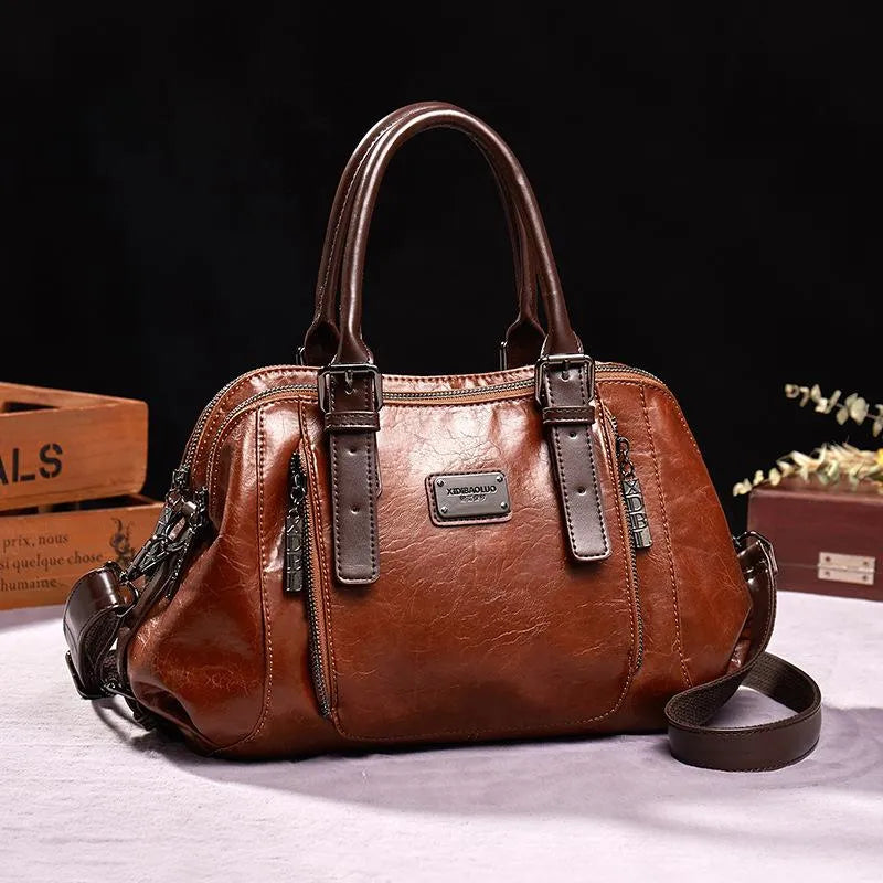 Luxe dames leren handtas met elegante textuur, praktisch en ruim verkrijgbaar in bruin, groen, rood of zwart voor een veelzijdige stijl