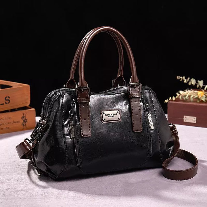Luxe dames leren handtas met elegante textuur, praktisch en ruim verkrijgbaar in bruin, groen, rood of zwart voor een veelzijdige stijl