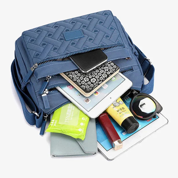 Luxueuze schoudertas voor dames van waterdicht nylon, veelzijdig, praktisch, vooraanzicht in diverse kleuren.