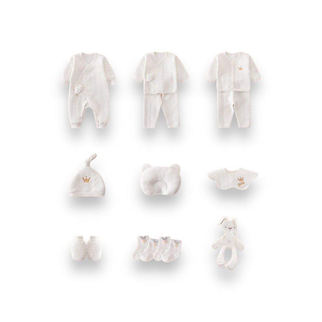 Luxe geschenkset voor pasgeborenen met zachte rompertjes, knusse dekens en schattige accessoires in pastelkleuren.