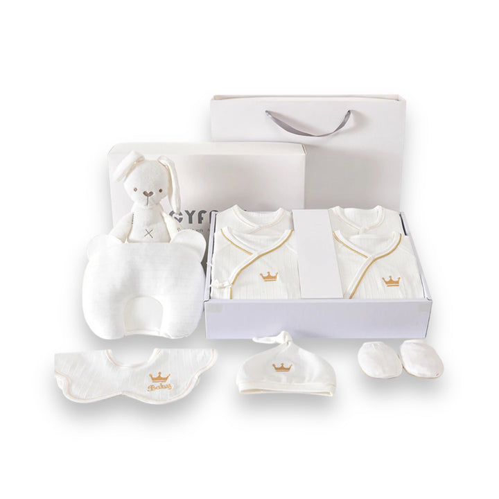 Luxe geschenkset voor pasgeborenen met zachte rompertjes, knusse dekens en schattige accessoires in pastelkleuren.