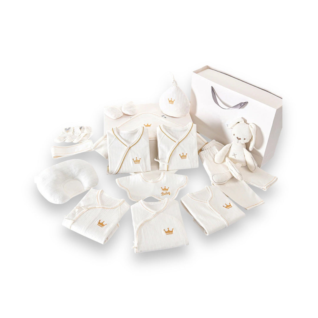 Luxe geschenkset voor pasgeborenen met zachte rompertjes, knusse dekens en schattige accessoires in pastelkleuren.
