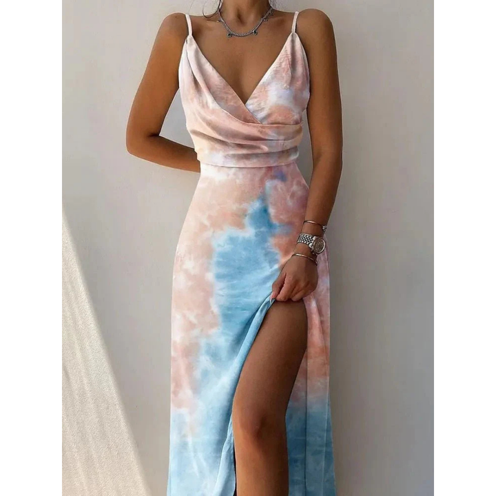Maxi jurk met bloemenprint voor dames, vloeiende snit met zijsplit, elegant bloemendesign, perfect voor de zomer.