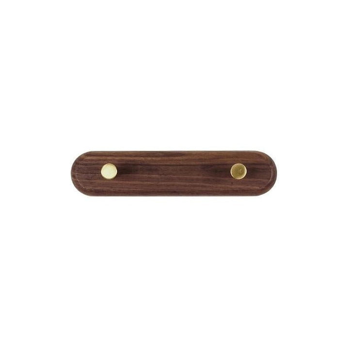 LignaHook minimalistische wandkapstok van hout met messing haken. Ideaal voor een opgeruimde slaapkamer of hal.