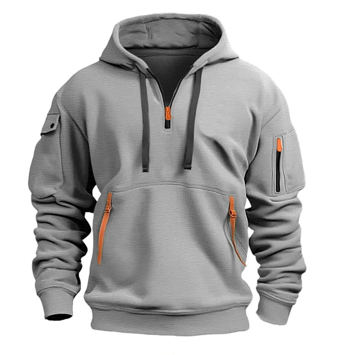 De grijze Adriano Hoodie met halve rits, een perfecte combinatie van stijl en comfort voor mannen.