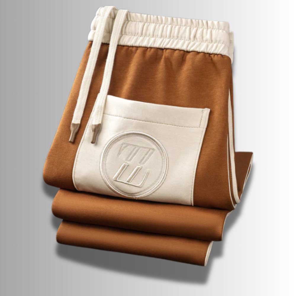 Modern heren joggingpak, ademend, in het grijs met capuchon en zakken, ideaal voor sport en vrije tijd.