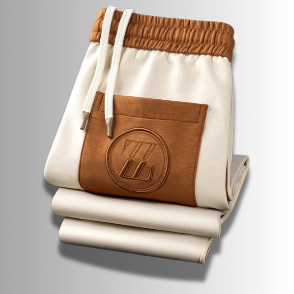 Modern heren joggingpak, ademend, in het grijs met capuchon en zakken, ideaal voor sport en vrije tijd.