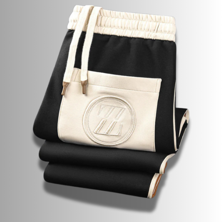 Modern heren joggingpak, ademend, in het grijs met capuchon en zakken, ideaal voor sport en vrije tijd.