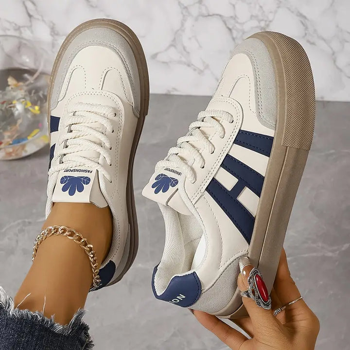 Gedetailleerde dames plateau sneakers Talia, toont hoogwaardige materialen en chunky zool.