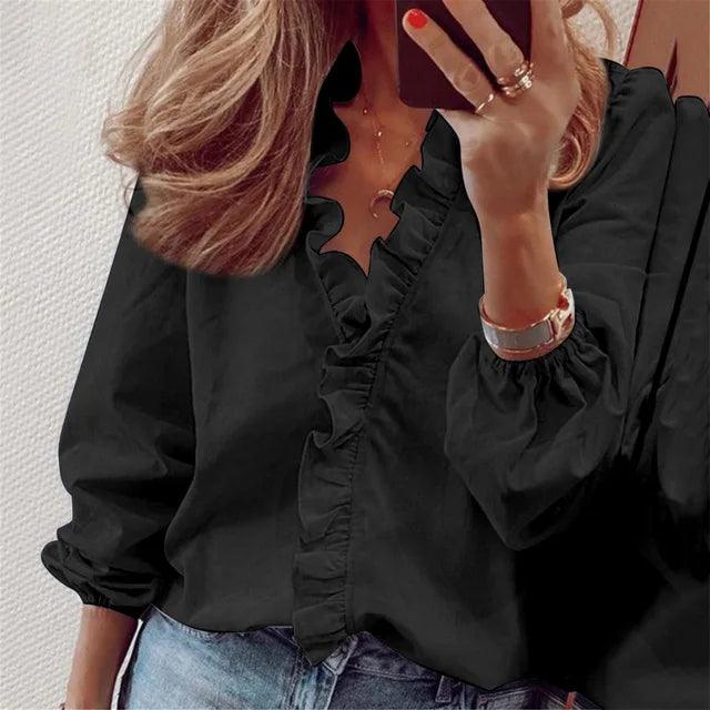 Damesblouse: ruche V-hals, lange ballonmouwen, knoopsluiting. Elegante vrouwenmode top, casual chic.