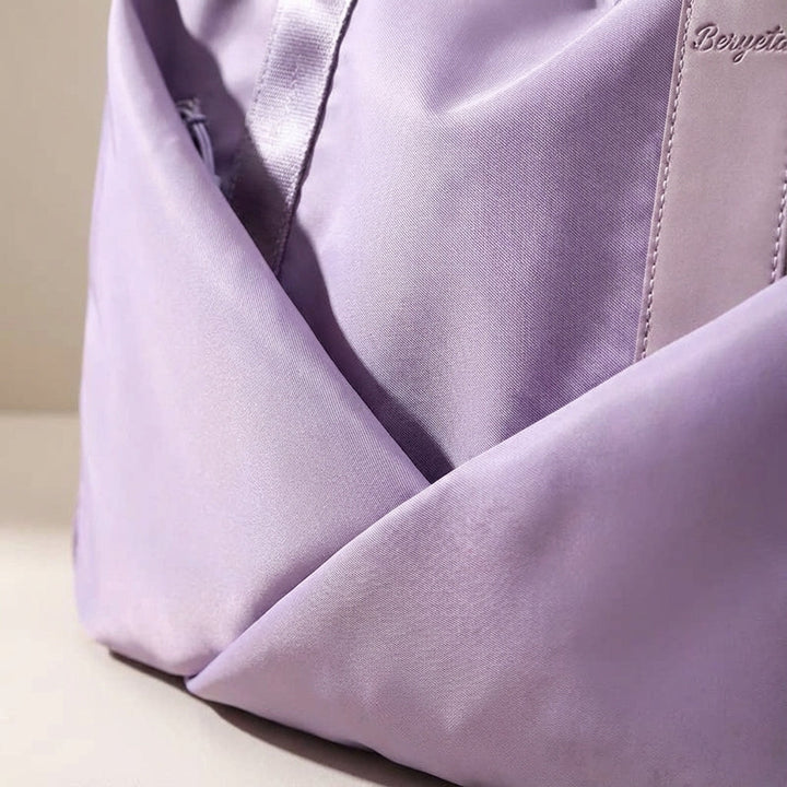 Unisex Movella gymtas/sporttas met apart vak voor natte kleding, ideaal voor fitness en zwemmen.
