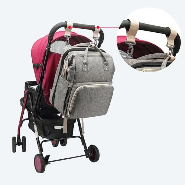 Flesverwarmer functie in de waterdichte luiertas rugzak met opvouwbaar wiegje. Houdt babyflesjes warm tijdens reizen.