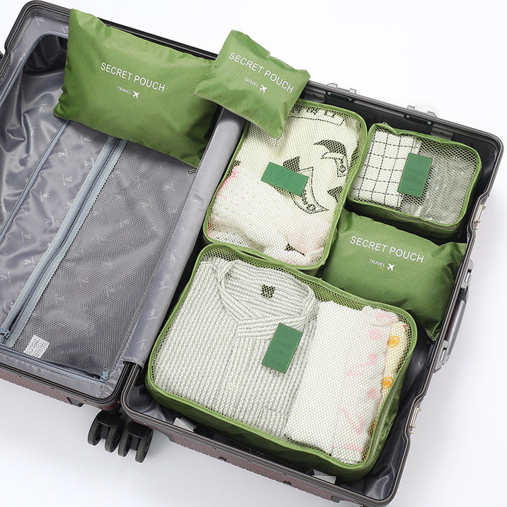 Georganiseerde reisset met stevige inpakblokjes, essentieel voor een overzichtelijke en stressvrije vakantie.