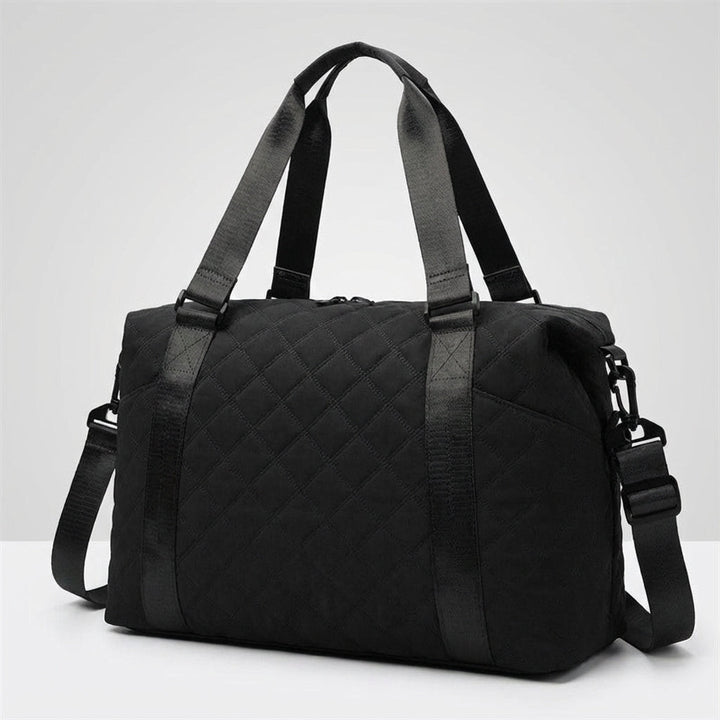 Quiltiva gewatteerde weekendtas: een ruime en trendy duffel. Perfect als handbagage en reistas voor unisex gebruik.