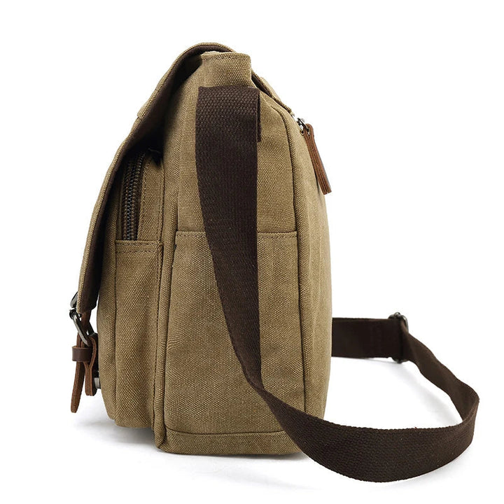 Heren werk tas: robuuste canvas schoudertas met verstelbare riem en veilige sluiting.