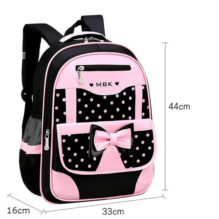 Stijlvolle roze meisjes schooltas met zwarte stippen, strik detail. Trendy en comfortabele Shelly rugzak voor basisschool.