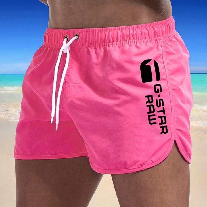 Sneldrogende blauwe heren zwembroek, stijlvol design, elastische tailleband, ideaal voor strand en zwembad.