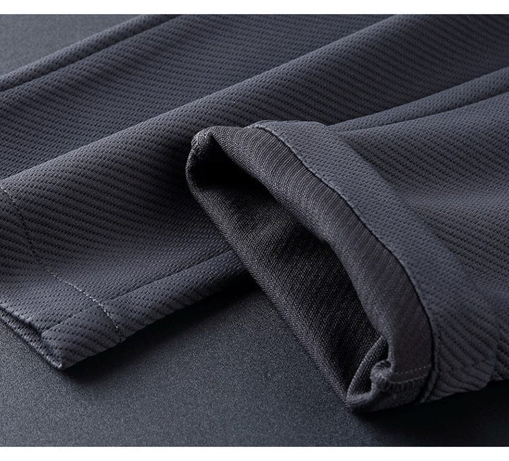 Zwart Elite Trainingspak voor mannen, modern design met opstaande kraag en ritssluiting, flexibel en comfortabel.