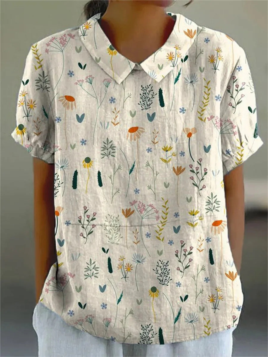 Zomerblouse met wilde bloemenprint, pastelkleurig, losvallend, ideaal voor warme dagen; damesmode, stijlvol en comfortabel.