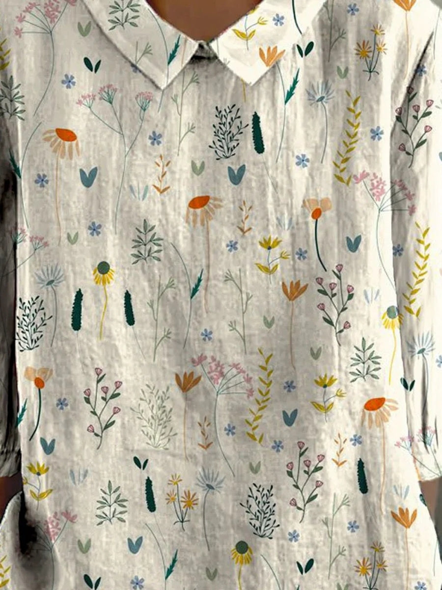 Zomerblouse met wilde bloemenprint, pastelkleurig, losvallend, ideaal voor warme dagen; damesmode, stijlvol en comfortabel.