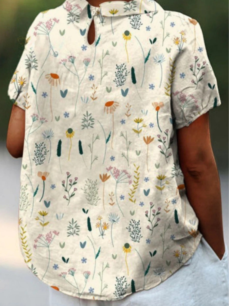 Zomerblouse met wilde bloemenprint, pastelkleurig, losvallend, ideaal voor warme dagen; damesmode, stijlvol en comfortabel.