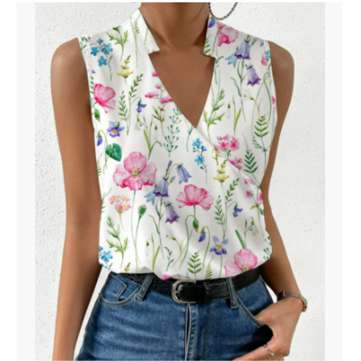Zomerse, zachte damestop met V-hals, mouwloos, wit, luchtige stof. Perfect voor casual zomerlooks.
