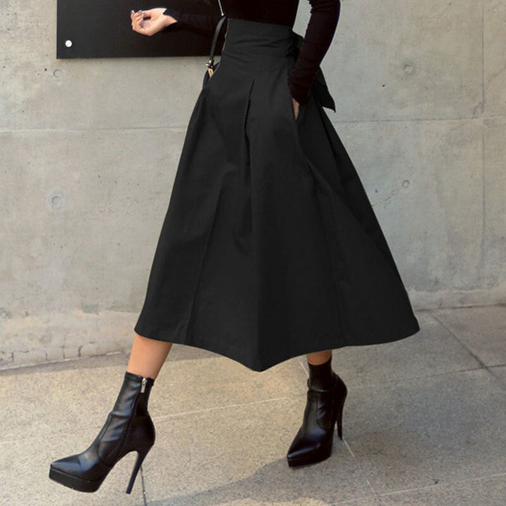 Elegante zwarte halflange rok, veelzijdig en stijlvol voor elke gelegenheid. Een must-have voor dames.