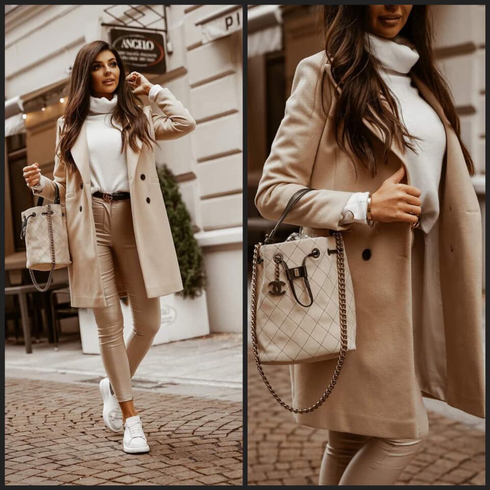 Tijdloze lange zwarte damesjas, een elegante keuze voor bovenkleding. Essentiële dameskleding voor elk seizoen.