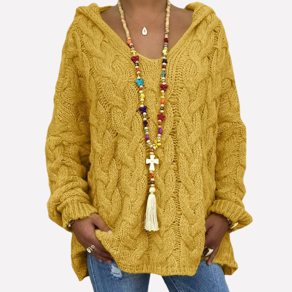 Relaxte oversized dames trui met v-hals en kabelpatroon. Perfect als casual bovenkleding voor koude herfst- en winterdagen.
