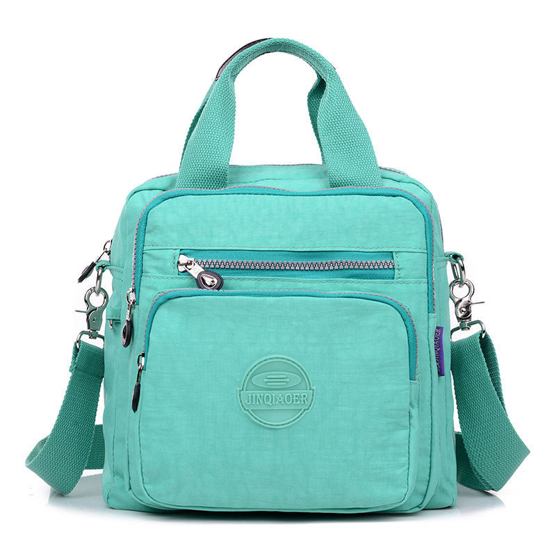 Waterdichte crossbody tas voor dames met veilige ritssluitingen, beschermt je waardevolle spullen.