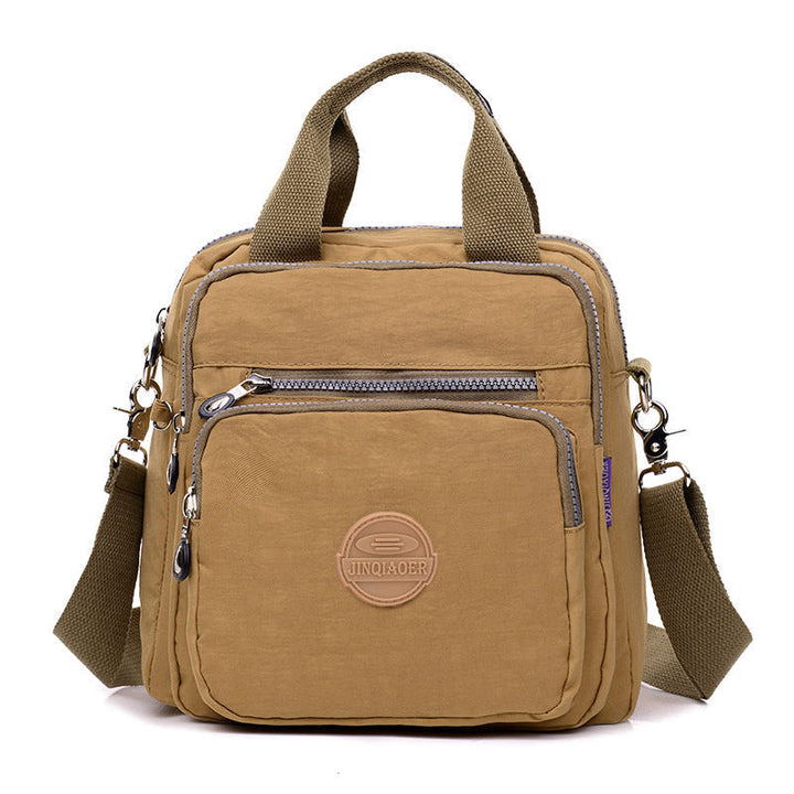 Robuuste en waterdichte crossbody tas voor dames, ideaal voor outdoor avonturen of regenachtige dagen.