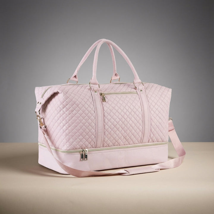 Zwarte leren reistas, de ideale unisex weekendtas voor korte trips; met schoenvak en ruimte voor al je benodigdheden.