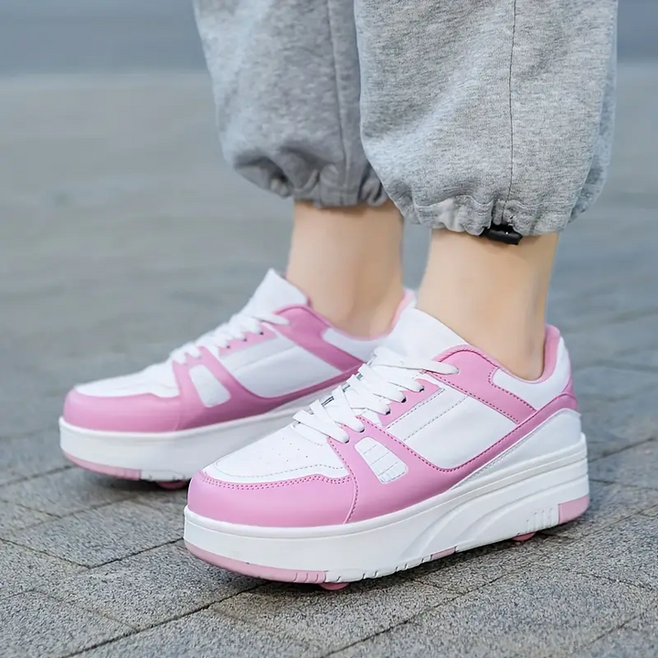 Stijlvolle kinderrolschaatsen met afneembare wielen voor buitenavonturen, die een actieve levensstijl bevorderen. Roze, zwart en wit beschikbaar.