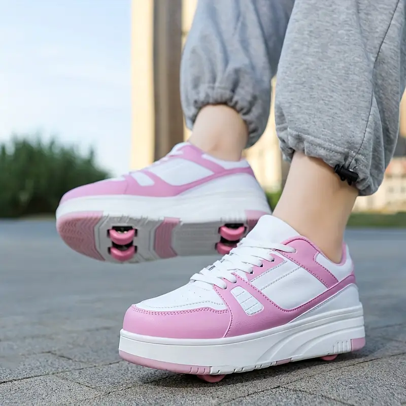 Stijlvolle kinderrolschaatsen met afneembare wielen voor buitenavonturen, die een actieve levensstijl bevorderen. Roze, zwart en wit beschikbaar.