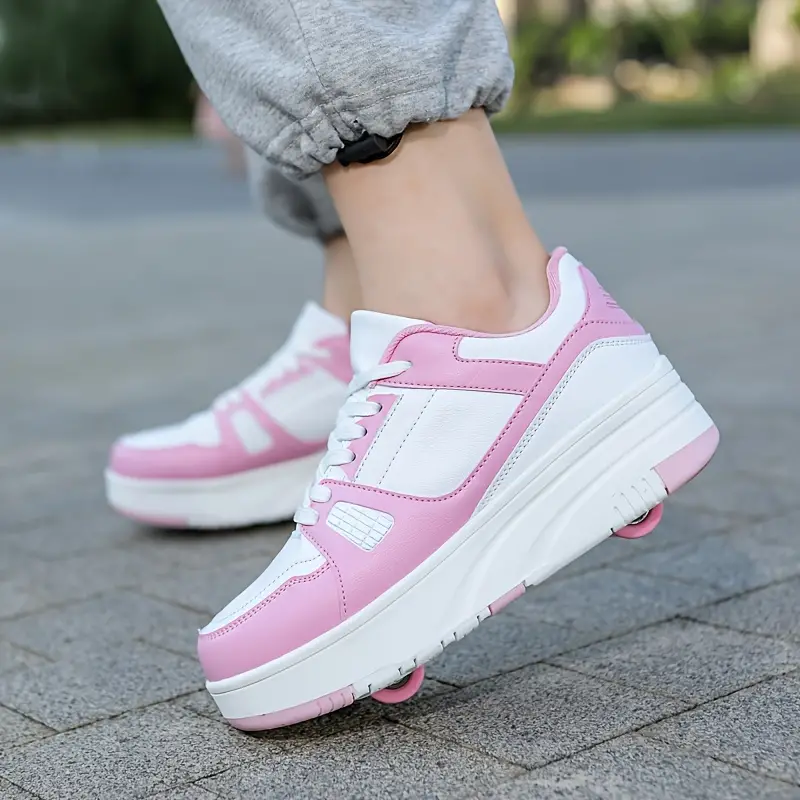 Stijlvolle kinderrolschaatsen met afneembare wielen voor buitenavonturen, die een actieve levensstijl bevorderen. Roze, zwart en wit beschikbaar.