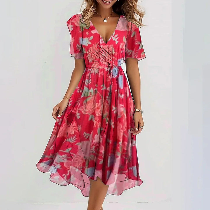 Bloemen midi-jurk aan de achterkant, toont de elegantie en het comfortabele ontwerp.