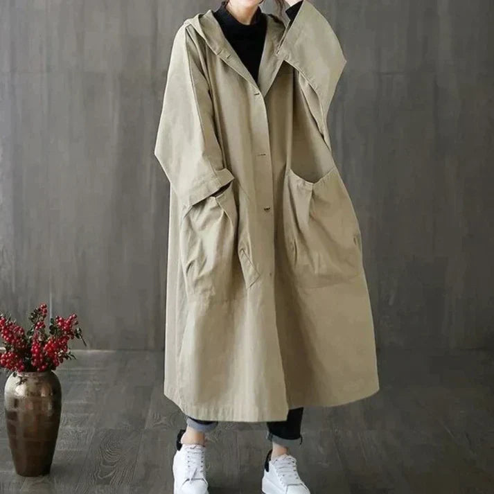Elegante zwarte oversized trenchcoat voor dames, stijlvol en weerbestendig, ideaal voor herfst/lente.