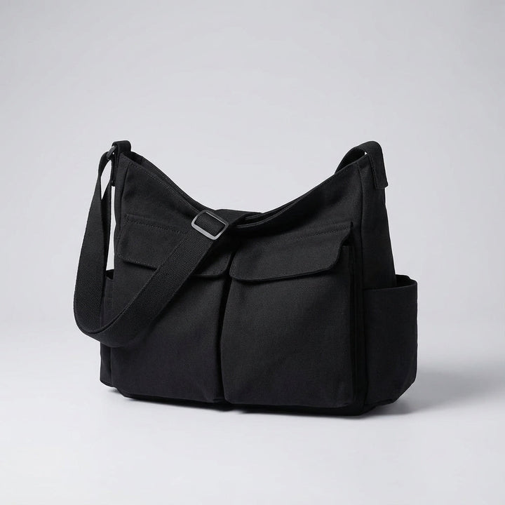 Duurzame canvas messenger tas; een stevige schoudertas voor langdurig dagelijks gebruik. Praktisch unisex design.
