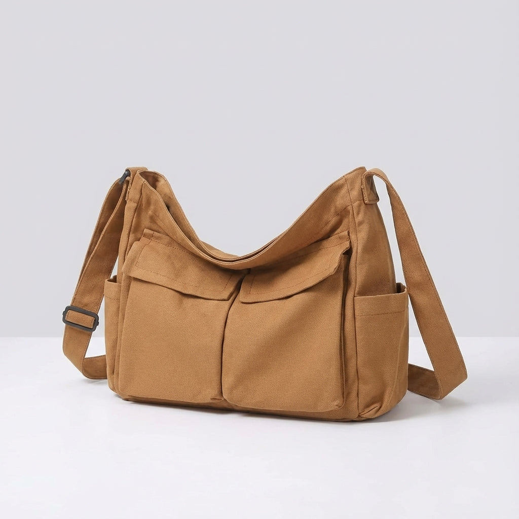 Ruime canvas messenger tas voor school, werk of reizen. Comfortabele unisex crossbody schoudertas.