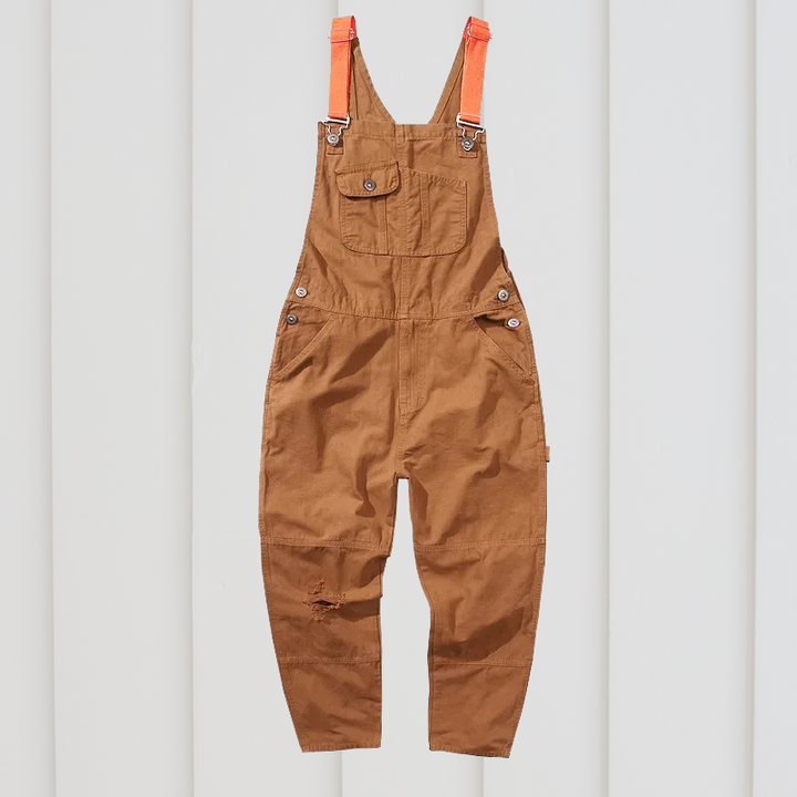 Unisex tuinbroek, groen, met schouderbanden en zakken, robuust en comfortabel voor buitenwerk en flexibele bewegingen.