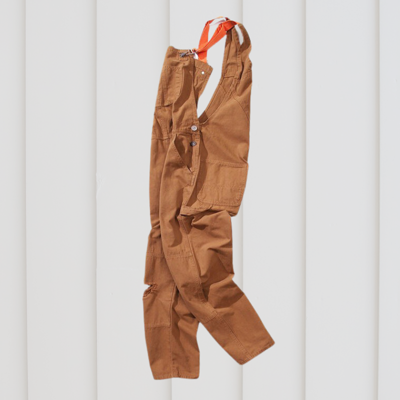 Unisex tuinbroek, groen, met schouderbanden en zakken, robuust en comfortabel voor buitenwerk en flexibele bewegingen.