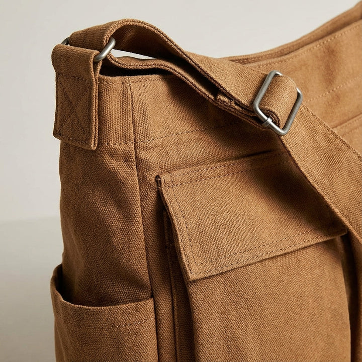 Lichtgewicht canvas organisertas Packlite, comfortabele unisex schoudertas met ruime vakken voor dagelijks gebruik.