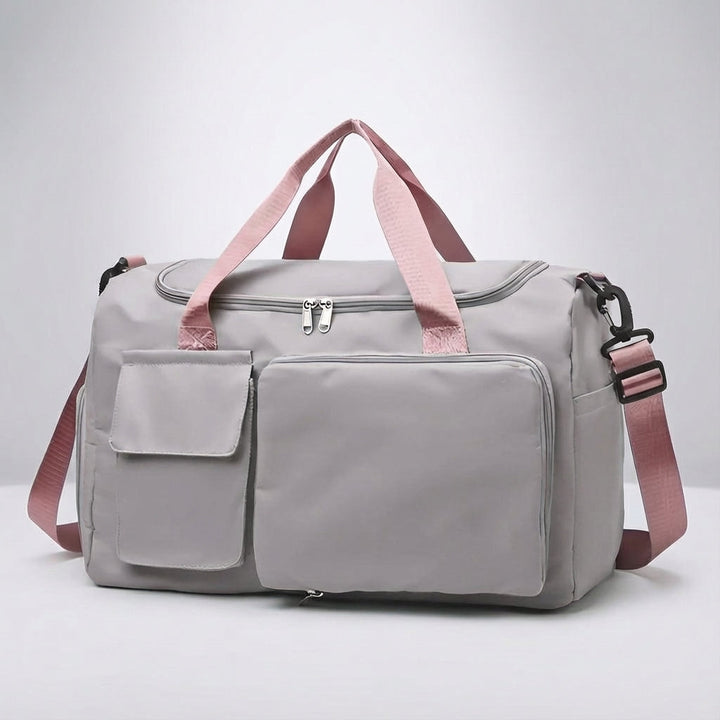Detail van robuuste rits en verstelbare schouderband op deze duurzame unisex weekendtas/sporttas.