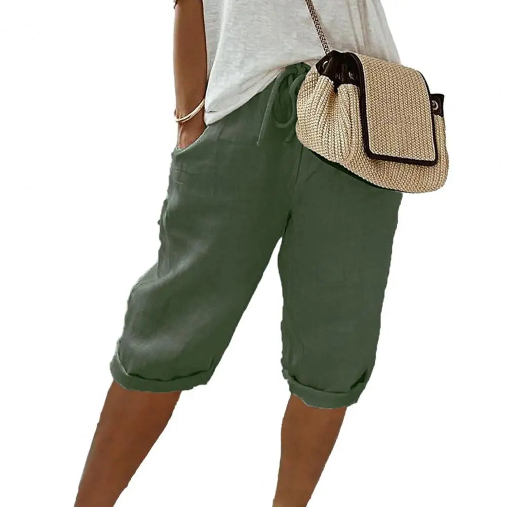 Losvallende vintage kniebroek unisex, met elastische taille en praktische zakken, een comfortabele zomerbroek.