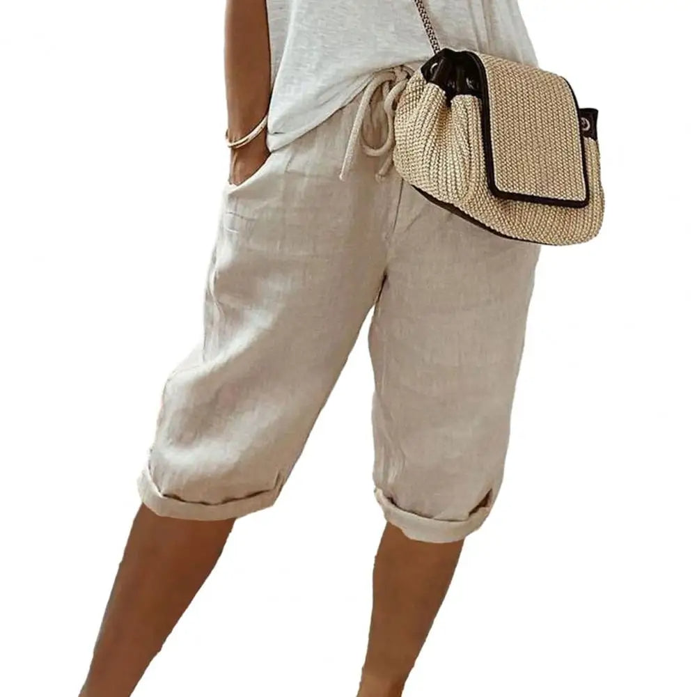 Comfortabele unisex kniebroek met vintage look, elastische taille en functionele zakken, ideaal voor zomerse outfits.