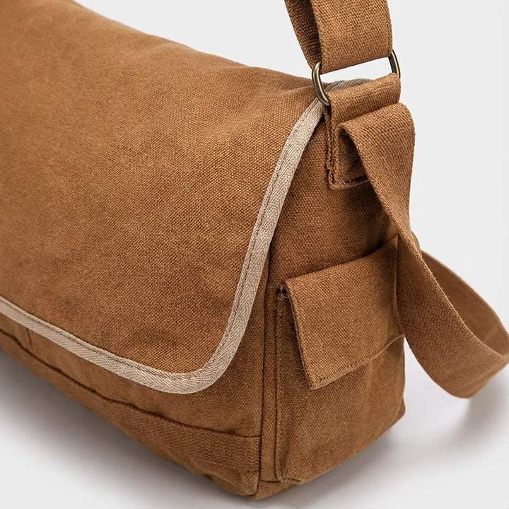 Duurzame vintage canvas schoudertas UrbanSatchel, met ruime opbergruimte. Ideaal als werktas of reistas.